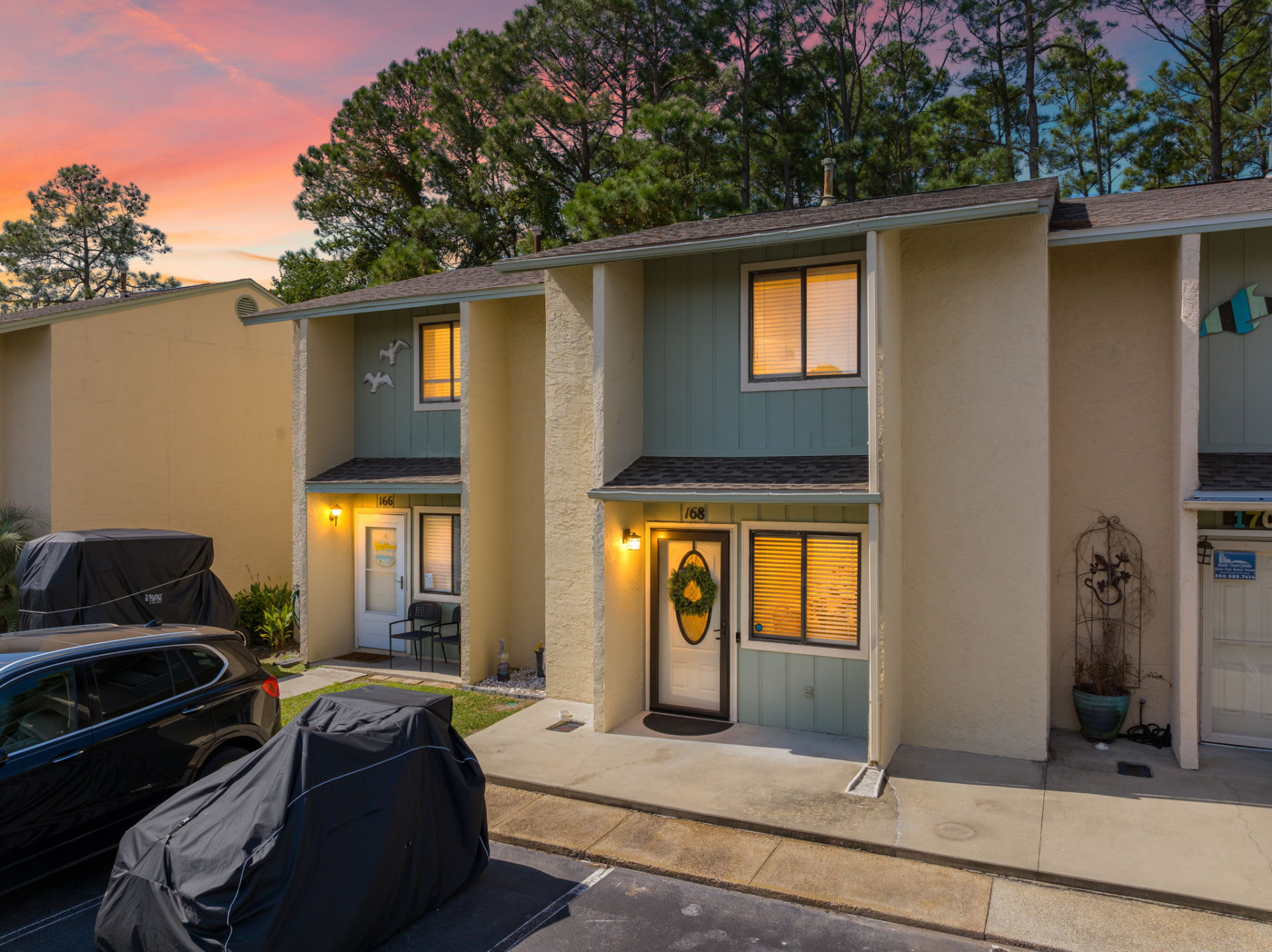 Front entry of a two-story short-term rental townhome at sunset